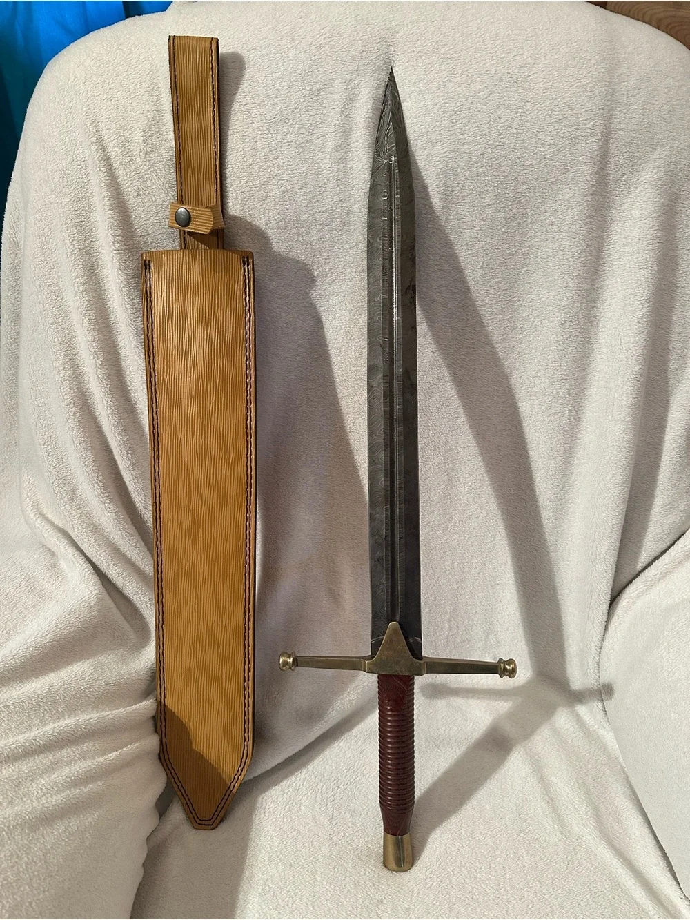 Damascus Rhindon Sword. Comes with yellow sheath.